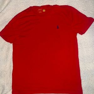 Red polo shirt with blue logo